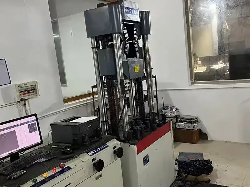 Tensile strength test for DIN 6921 flange bolt, fastener quality inspection in factory laboratory